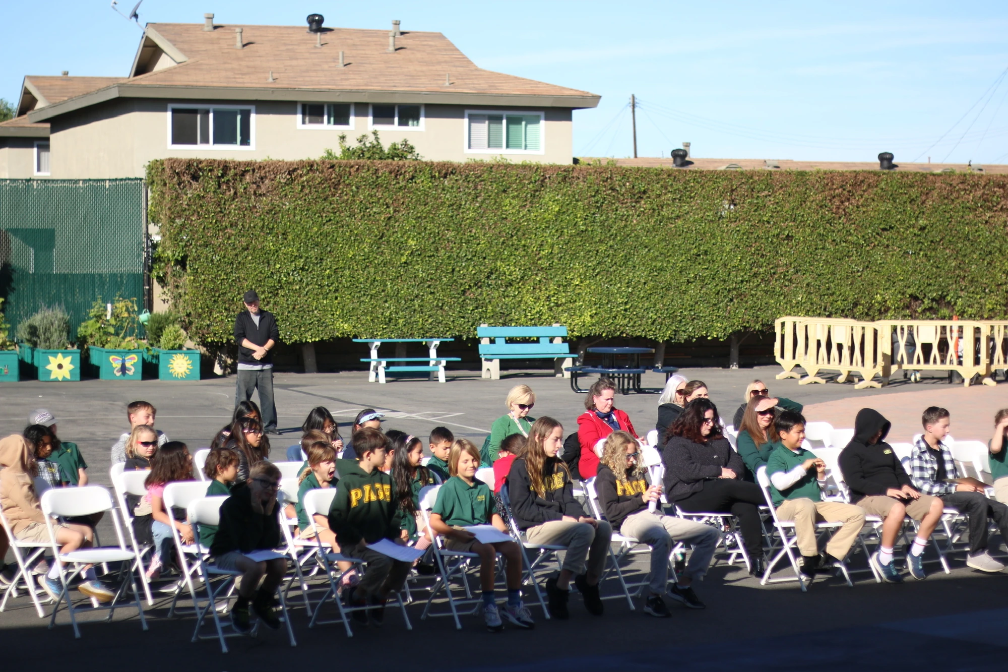 Page Academy students and families gathered for an outdoor assembly
