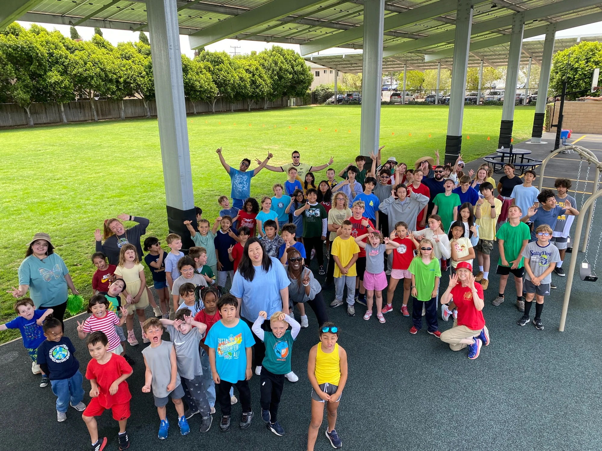 Page Academy students cheering under the campus canopy