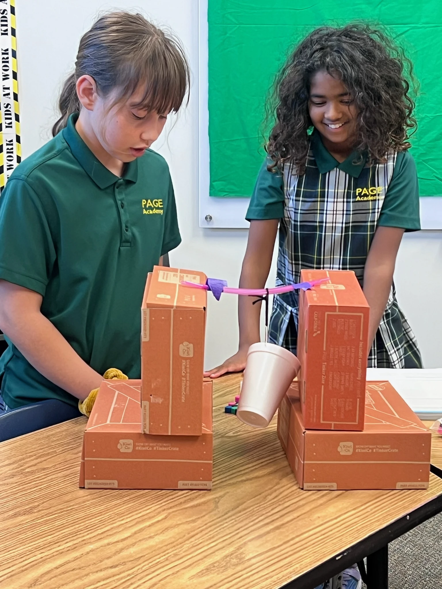 Two elementary students running an experiment