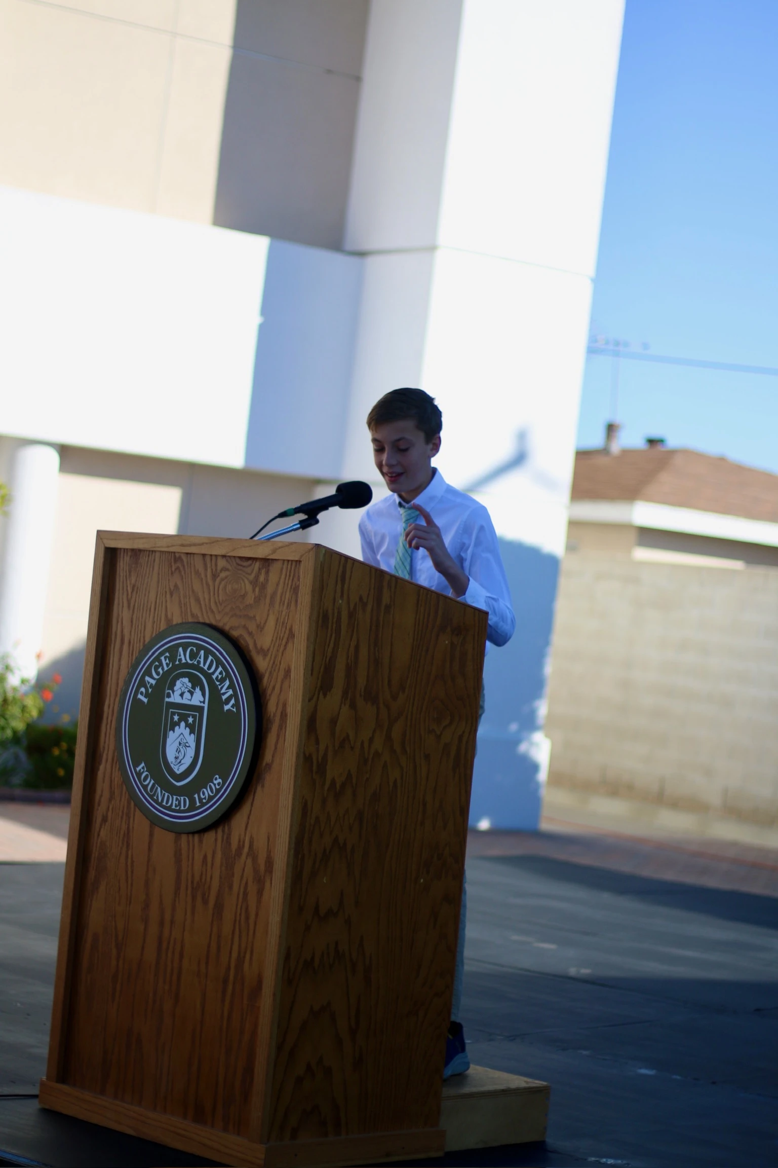 Page Academy student speaking at the school podium