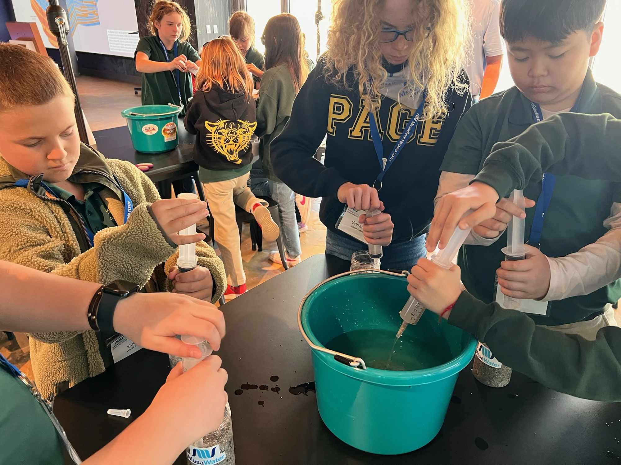 Page Academy students running a science experiment