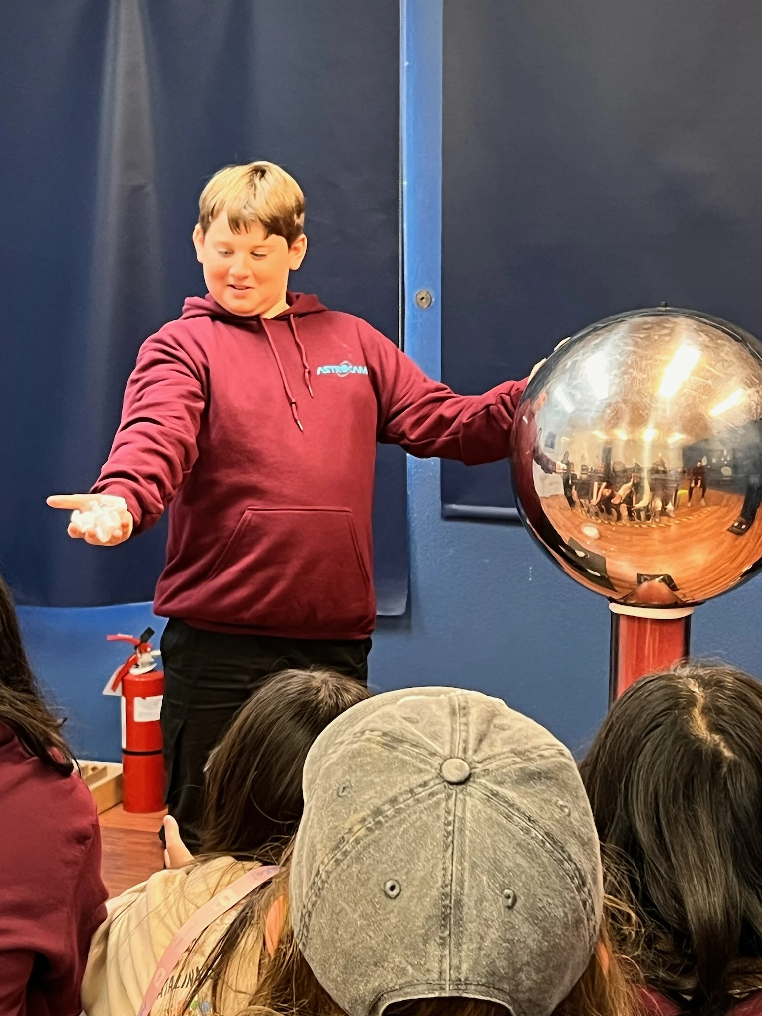 Page Academy student trying a static electricity generator at AstroCamp